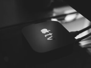 Black and white image of an Apple TV device.