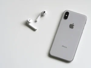 Apple airpods 2 next to an iphone 10