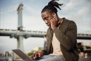 A person show how to skip a song with Apple AirPods