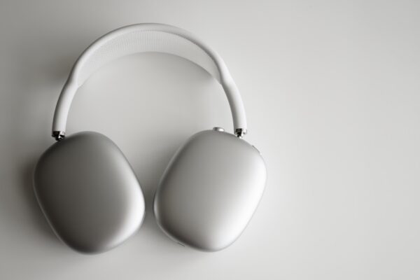 white wireless headphones on white table