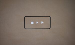 a black and white button on a brown background