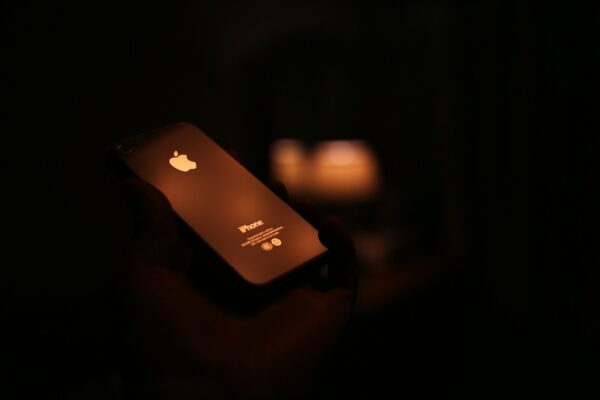 apple iphone on black surface