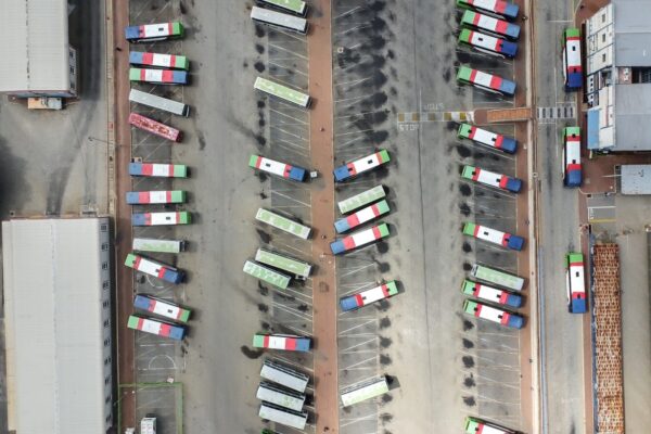 an aerial view of a parking lot filled with cars