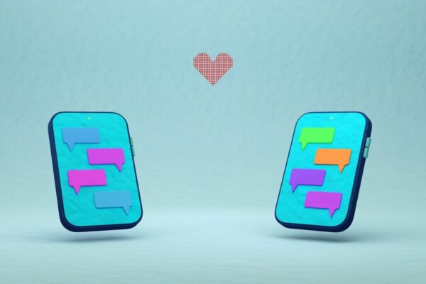 Two phones with chat bubbles and a red heart.